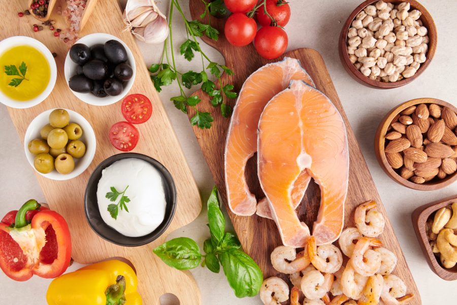 Balanced nutrition concept for clean eating flexitarian mediterr Balanced nutrition concept for clean eating flexitarian mediterranean diet Top view flat. Nutrition, clean eating food concept. Diet plan with vitamins and minerals. Salmon and Shrimp, Mix vegetables